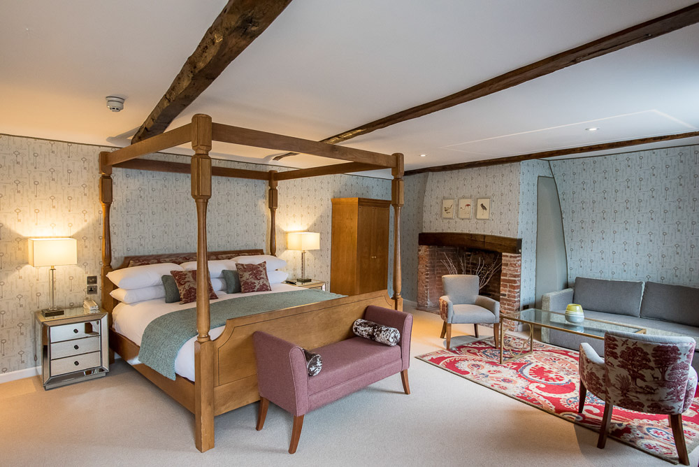 The Ranworth Suite's four-poster bed and sofa
