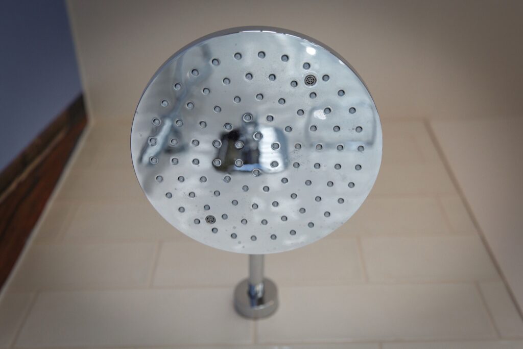A chrome rainfall shower head